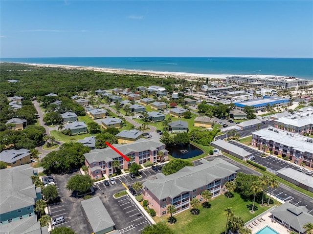 aerial view featuring a water view and a view of the beach