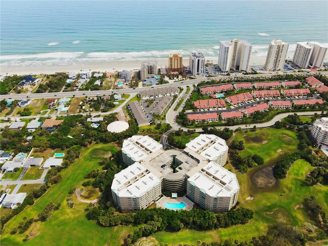 drone / aerial view with a water view and a view of the beach