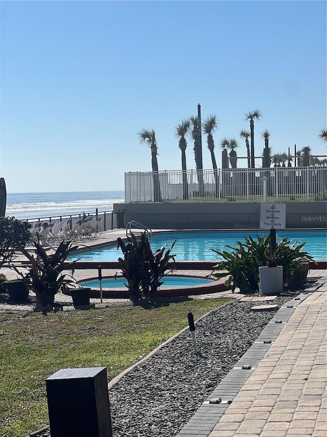 view of pool featuring a water view