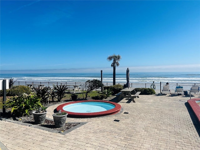 view of pool featuring a water view