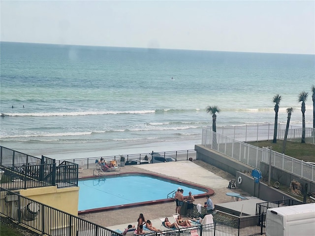 view of pool featuring a water view