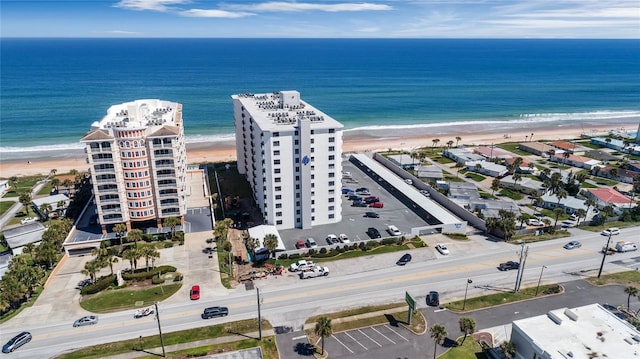 birds eye view of property featuring a water view and a view of the beach