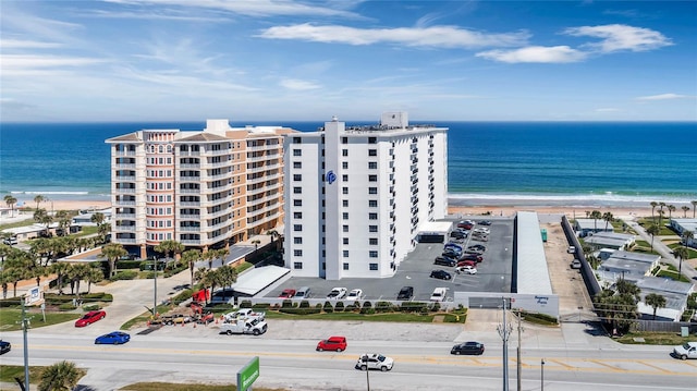 bird's eye view with a water view and a beach view