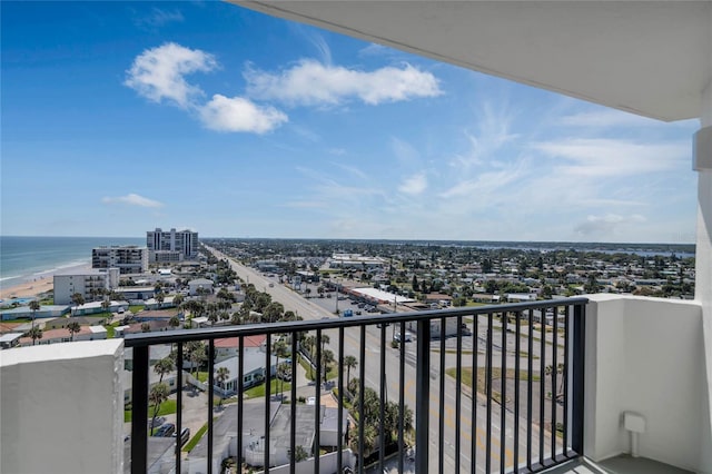 balcony with a view of the beach and a water view