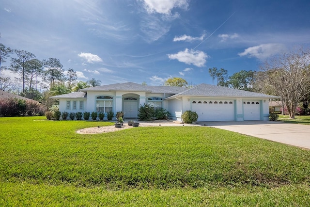 view of front of house featuring a garage and a front yard