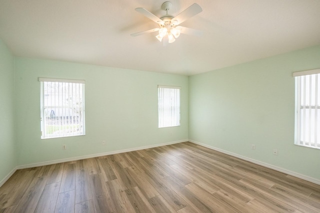 spare room with ceiling fan and light hardwood / wood-style flooring