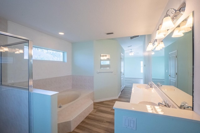 bathroom with vanity, hardwood / wood-style floors, lofted ceiling, ceiling fan, and independent shower and bath