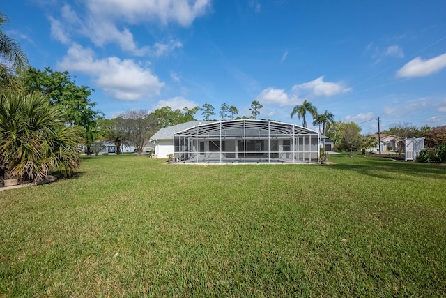 view of yard featuring glass enclosure