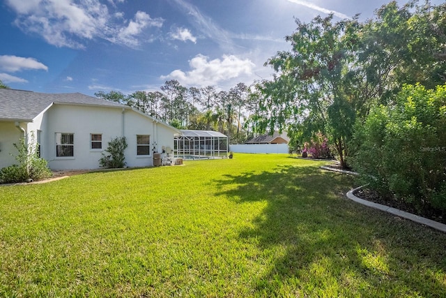 view of yard featuring a lanai