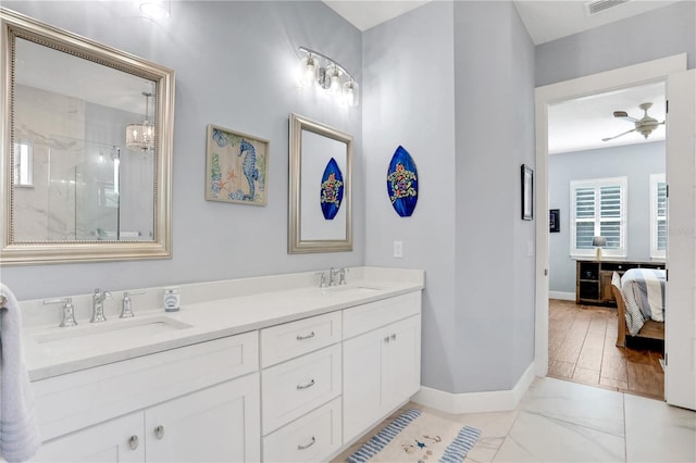 bathroom featuring vanity, ceiling fan, and an enclosed shower