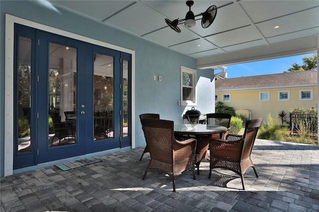 view of patio featuring ceiling fan and french doors