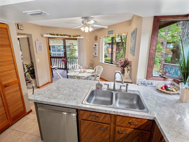 kitchen featuring stainless steel dishwasher, ceiling fan, light tile floors, and sink