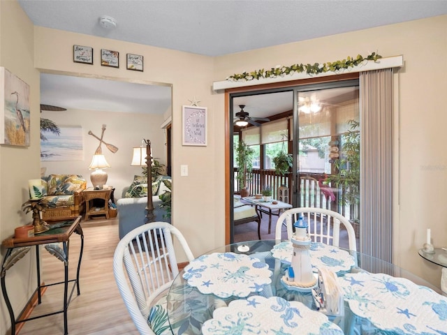 dining room featuring ceiling fan and light wood-type flooring