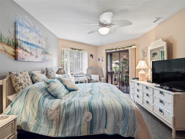 bedroom with dark colored carpet, ceiling fan, access to outside, and a textured ceiling