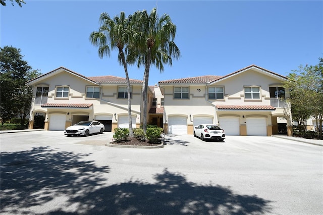 mediterranean / spanish house featuring a garage