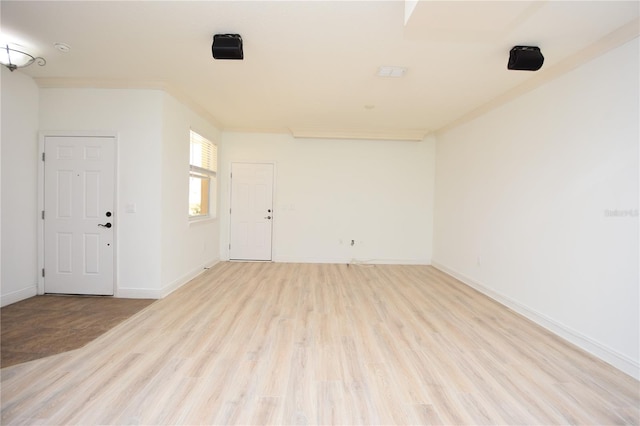 unfurnished room with light hardwood / wood-style flooring