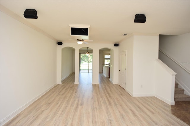 empty room featuring crown molding, ceiling fan, and light hardwood / wood-style flooring