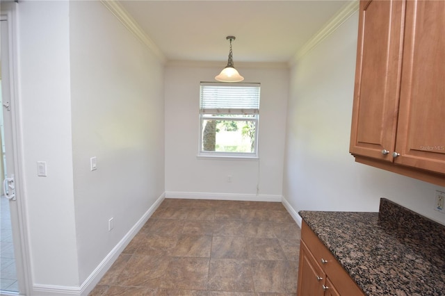 interior space with crown molding and light tile flooring