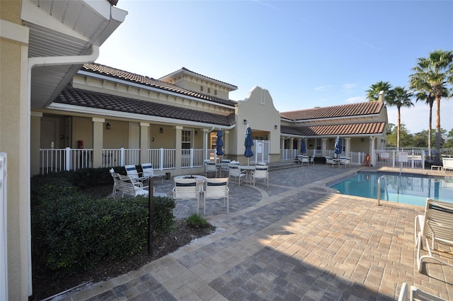 view of swimming pool featuring a patio area