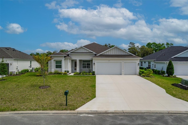 view of front of home featuring a front lawn and a garage