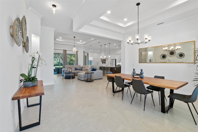 dining room featuring a raised ceiling, an inviting chandelier, ornamental molding, and light tile floors