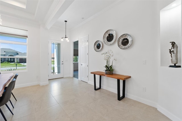 tiled foyer with crown molding and beam ceiling