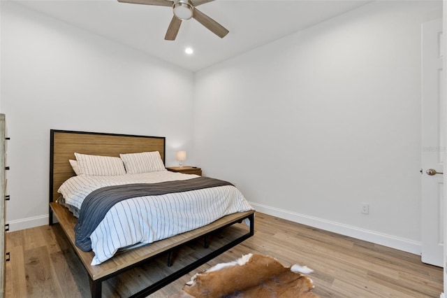 bedroom featuring ceiling fan and light wood-type flooring