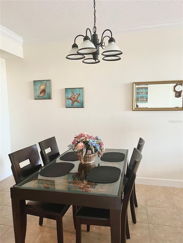 tiled dining space featuring crown molding, a notable chandelier, and a textured ceiling