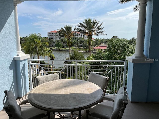 balcony featuring a water view