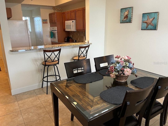 view of tiled dining area