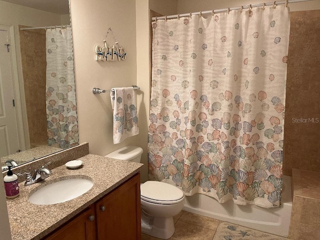 full bathroom with tile patterned flooring, vanity, shower / tub combo, and toilet