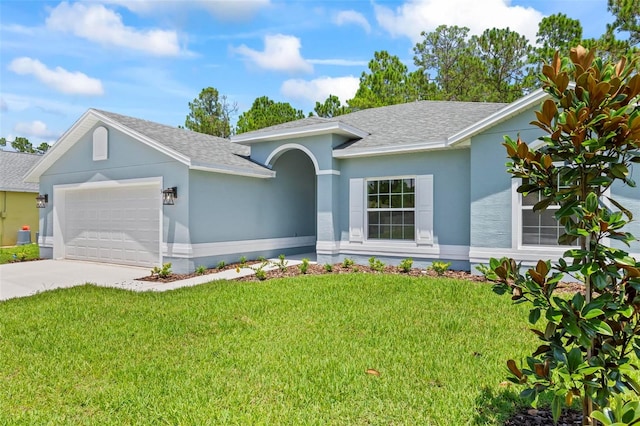 ranch-style house with a garage and a front lawn