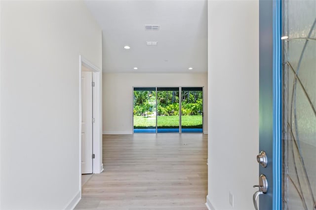 hall with light hardwood / wood-style flooring