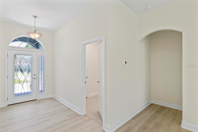 foyer entrance with light hardwood / wood-style flooring