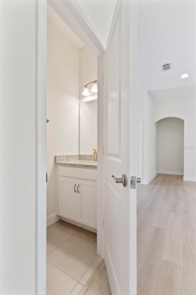 bathroom featuring vanity and hardwood / wood-style floors