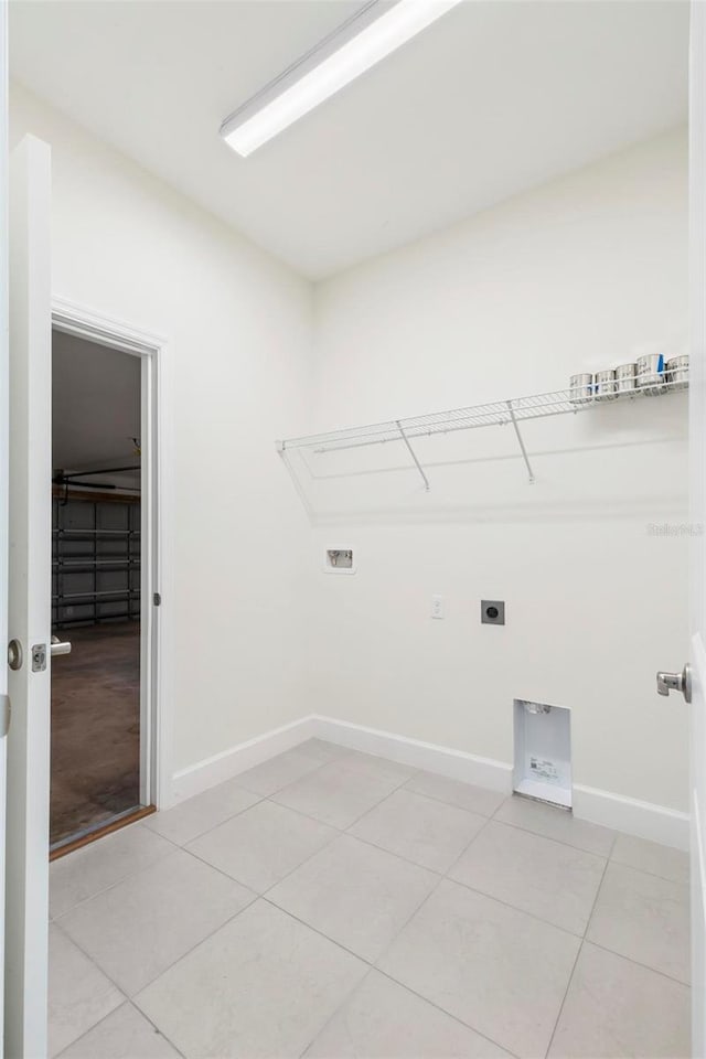 washroom with light tile patterned floors, washer hookup, and electric dryer hookup