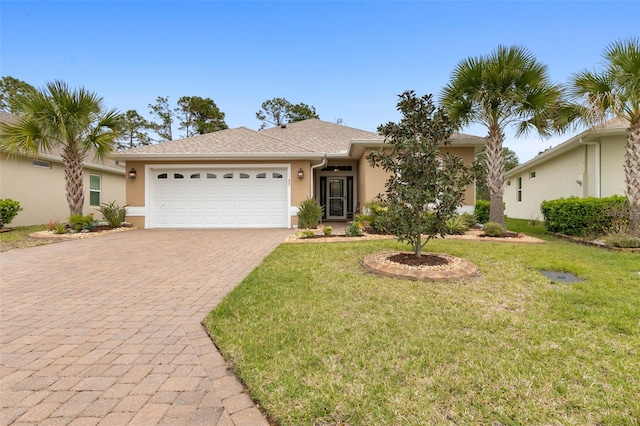 ranch-style home with a front yard and a garage