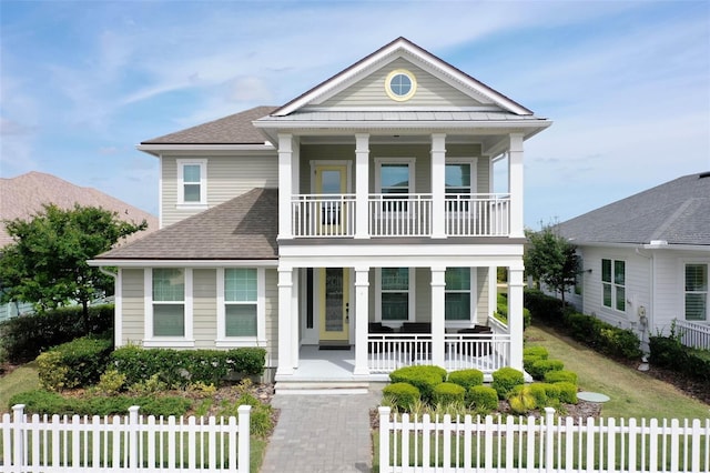 view of front facade with a balcony and a porch