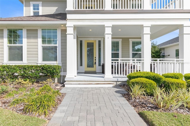 entrance to property featuring a porch