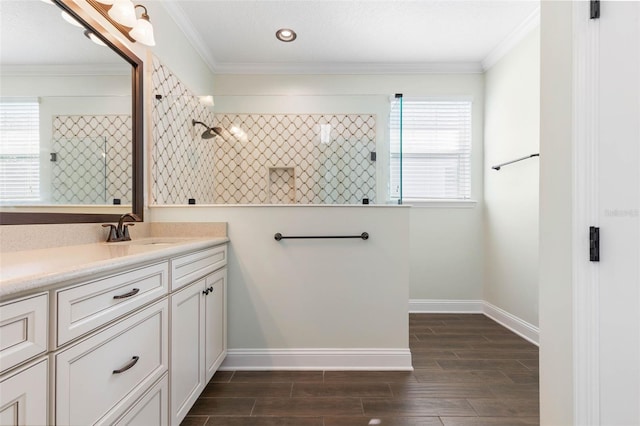 bathroom featuring vanity, a wealth of natural light, and ornamental molding