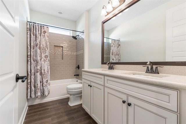 full bathroom with toilet, shower / tub combo, and vanity