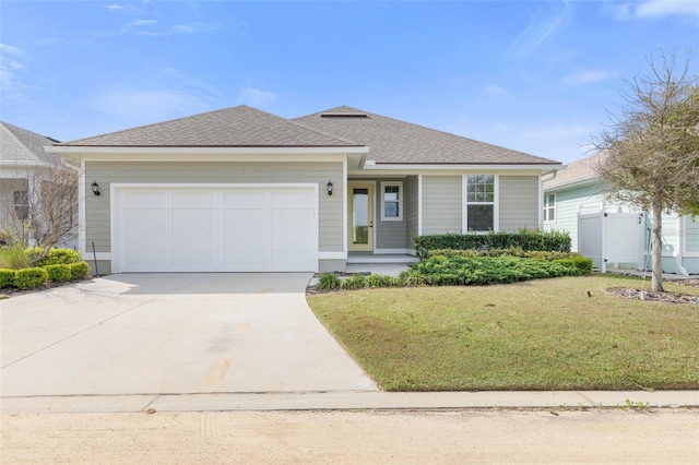 view of front facade featuring a front yard and a garage