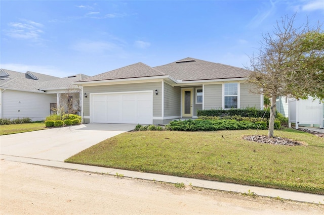 view of front facade with a front yard and a garage