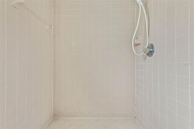 bathroom with tiled shower