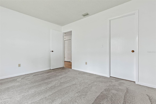 unfurnished bedroom featuring light colored carpet