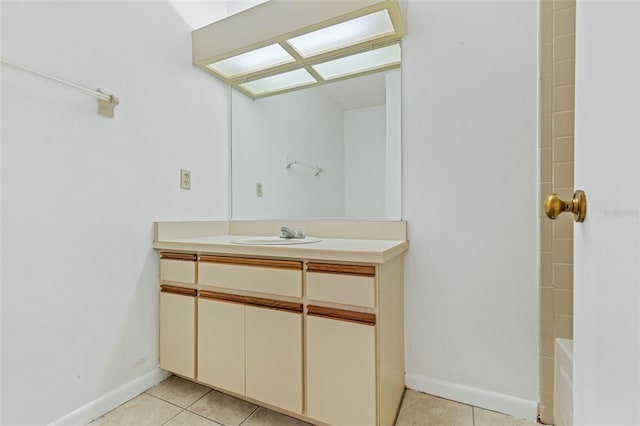 bathroom with vanity and tile flooring