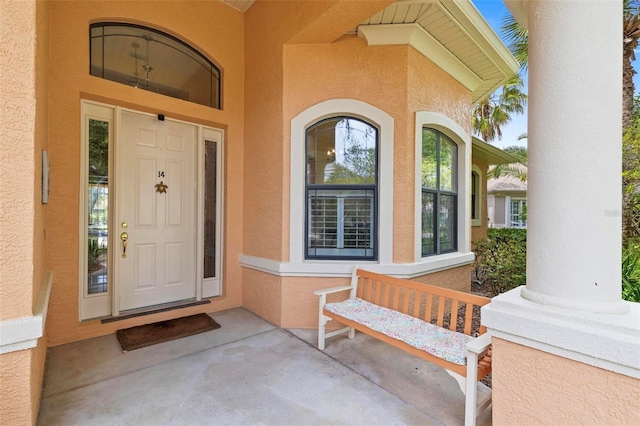 view of exterior entry featuring a porch