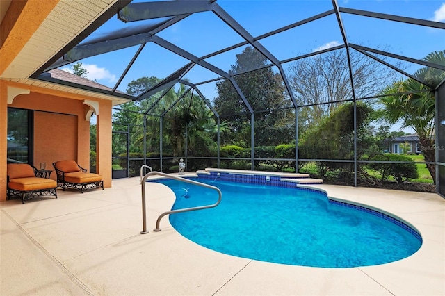 view of swimming pool with a patio and a lanai