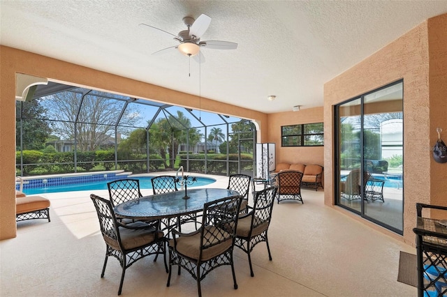 exterior space with a lanai, a patio area, and ceiling fan