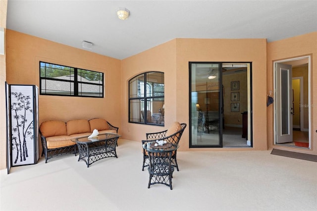 sitting room with carpet flooring